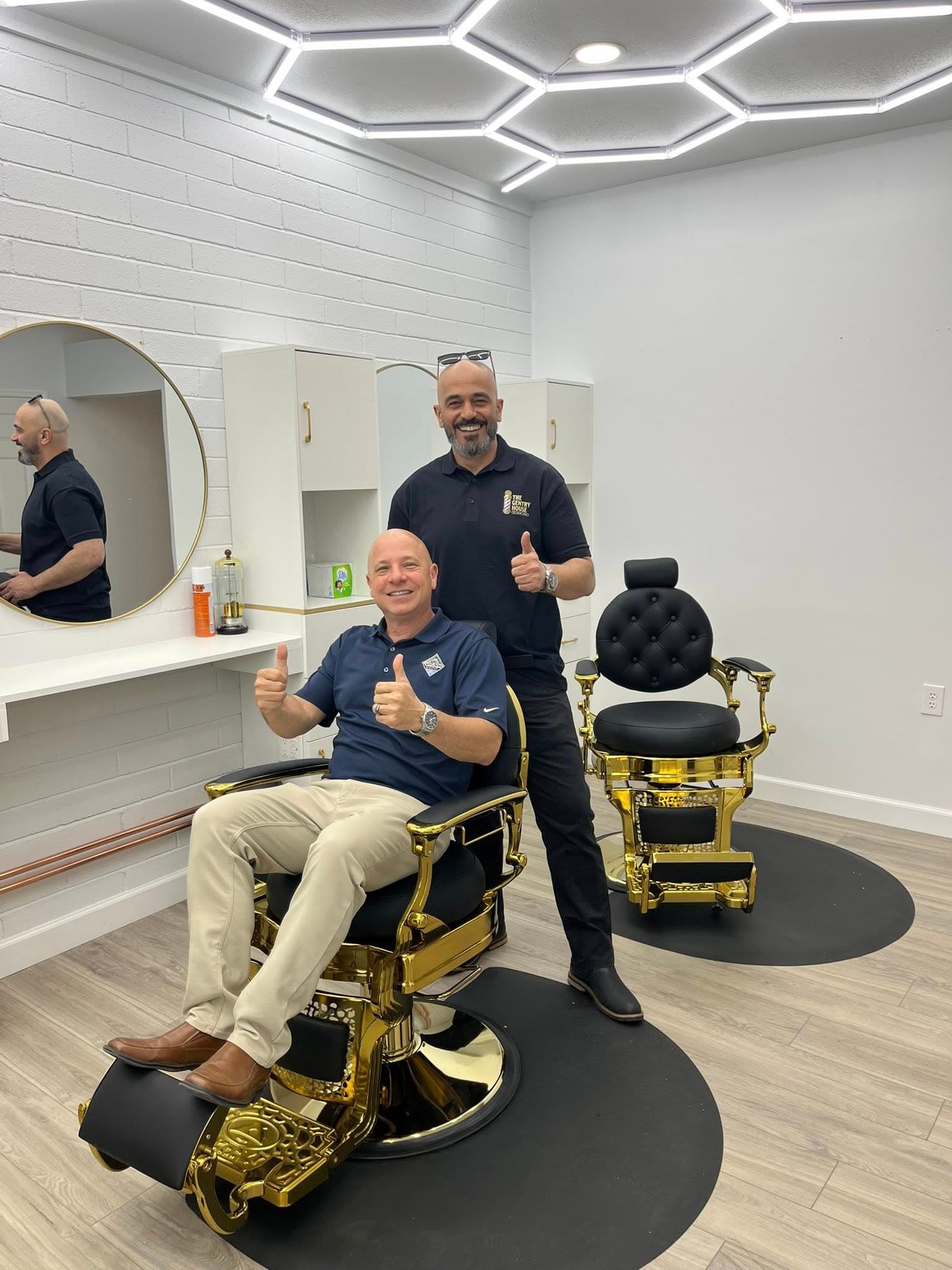 Luxury grooming studio interior with warm lighting and premium furnishings